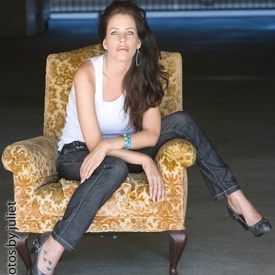 Woman posing on a sofa