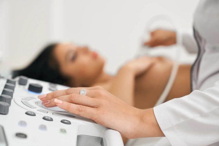 Woman examining a breast implant